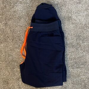 Women’s FIGS Joggers in Navy with Bright Orange Drawstring